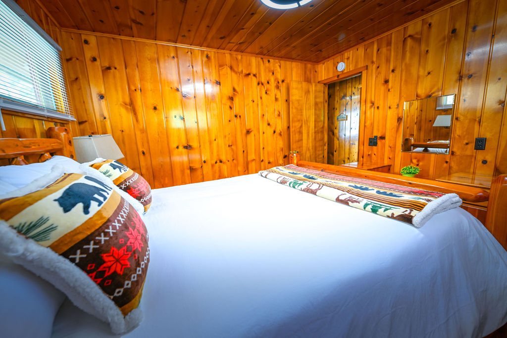 Warm wood cottage bedroom